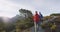 Couple Hiking At Routeburn Track In Fiordland National Park New Zealand