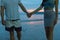 Couple Holding Hands On Beach At Sunset Closeup, Young Tourist Man And Woman On Sea Holiday