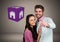 Couple Holding key with house icon cube in front of vignette