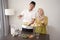 Couple holding opor ayam and ketupat for lebaran