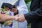 Couple holds hands while saying vows during wedding