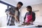 Couple At Home Baking Cake Together In Kitchen 