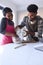 Couple At Home Baking Cake Together In Kitchen 