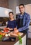 Couple in home kitchen prepairing healthy food