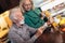 Couple at home measuring blood pressure and make healthy juices. Home monitoring