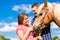 Couple with horse on pony farm