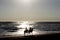 couple on horseback for romantic walk on the beach