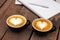 Couple hot coffee with latte art in heart shape. Favorite caffeine beverage. Refreshment drink in morning