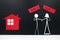 Couple human stick figure choosing between buy or rent a house in black background with copy space. Buying versus renting concept.