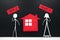 Couple human stick figure choosing between buy or rent a house in black background with copy space. Buying versus renting concept.