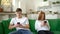 Couple ignoring each other using mobile phones. Anti-social couple ignore each other and glued to mobile phones social