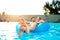 Couple in inflatable ring in pool. Summer and water.
