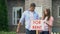 Couple installing for rent signboard, family needs additional income, crisis