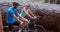 Couple interacting while cycling bicycle