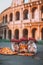 A couple of italian patriotic hamsters sitting on top of a pizza next to coliseum. Generative AI image.