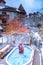 couple in jaccuzzi during winter in the snow, men and woman in pool during winter time with snow