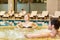 Couple in jacuzzi resting spa center.