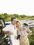 Couple By Jeep With Binoculars