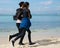 Couple jogging along the beach