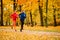 Couple jogging in autumn nature