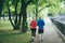 Couple jogging together in the early morning in a Munich park.