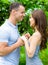 Couple joins hands near blossomed tree