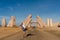 Couple jump near huge Gate of Allah, Ras Mohammed national park. Desert