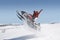 Couple Jumping Snowmobile In Snow