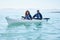 Couple, kayak and rowing boat on lake, ocean or river for water sports and fitness challenge. Portrait of man and woman