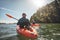 Couple kayaking in the lake on a sunny day