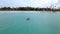Couple kayaking in the ocean on vacation Aruba Caribbean sea, man and woman mid age kayak in ocean blue clear water
