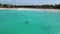 Couple Kayaking in the Ocean on Vacation Aruba Caribbean sea, man and woman mid age kayak in ocean blue clear water