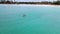 Couple kayaking in the ocean on vacation Aruba Caribbean sea, man and woman mid age kayak in ocean blue clear water