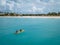 Couple Kayaking in the Ocean on Vacation Aruba Caribbean sea, man and woman mid age kayak in ocean blue clrea water