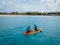 Couple Kayaking in the Ocean on Vacation Aruba Caribbean sea, man and woman mid age kayak in ocean blue clrea water