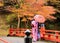 A couple in Kimono dress at autumnal scene, Japan