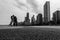 A couple kisses in front of the skyline of the city of Chicago