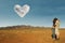 Couple kissing at Australian desert under love cloud