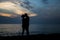 Couple kissing at the beach during sunset