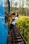 Couple kissing on a blue train in Sri Lanka