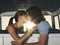 Couple Kissing In Campervan
