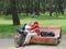 Couple kissing on a colorful park bench