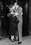 Couple kissing each other at a railroad station platform