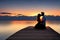 A couple kissing on a jetty over looking the sea at sunset. Generative AI