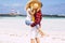 Couple kissing with love - concept of summer holiday vacation or honeymoon for people in relationship - background with beach and