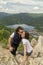 Couple kissing at mountain viewpoint