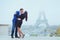 Couple kissing near Eiffel Tower in Paris, valentines day