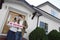 Couple Kissing Outside New House