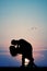 Couple kissing silhouette at sunset