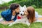 Couple kissing their fluffy husband spending weekend in summer house